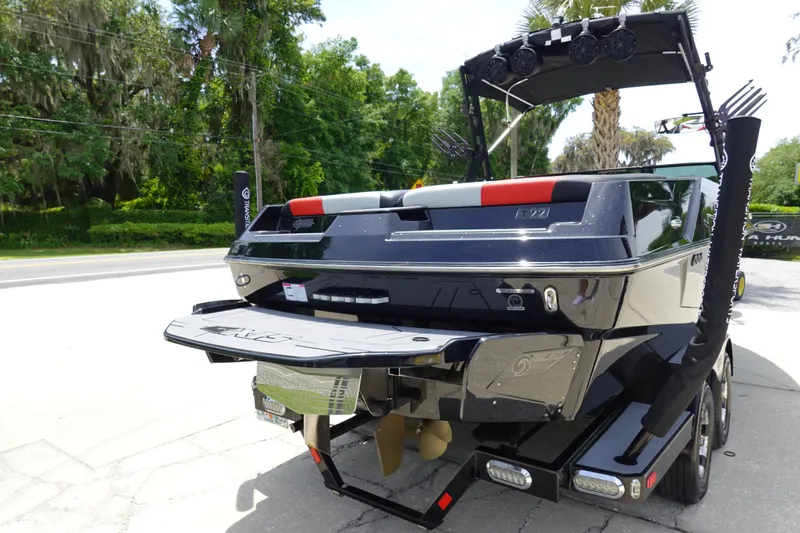 Slide: The Image of 2019 Axis T22 boat rear view with wakeboard tower and swim platform. - 6