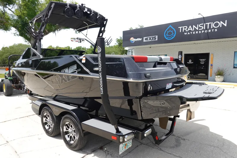 Slide: The Image of 2019 Axis T22 boat on trailer at Transition Watersports dealership. - 8