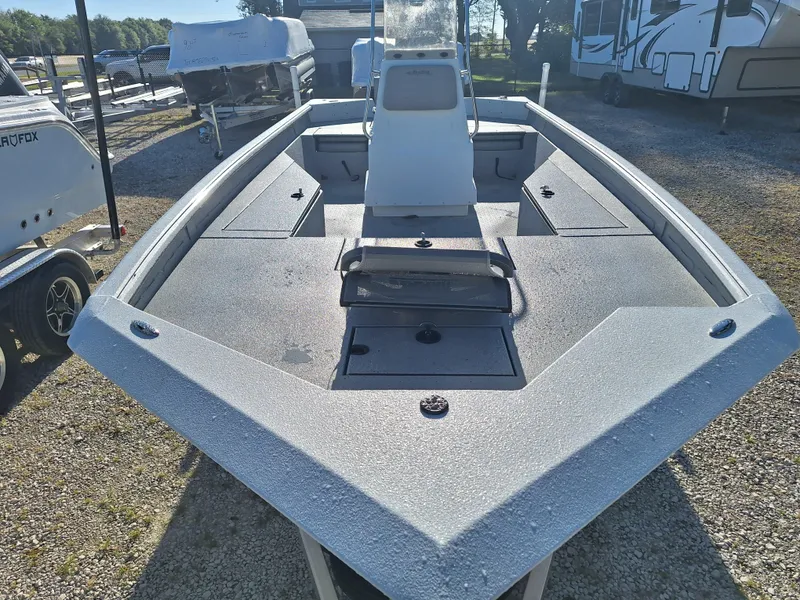 Slide: The Image of 2024 SeaArk 210 Bayrunner boat, front view, in a storage lot. - 6