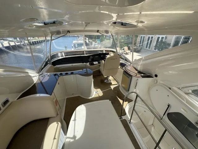 Slide: The Image of Interior of 2013 Meridian 441 Sedan yacht with helm station and seating area. - 12