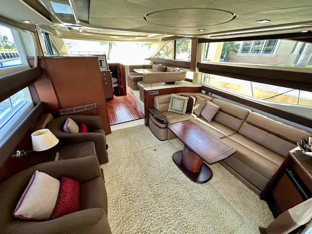 Slide: The Image of Luxurious interior of a 2013 Meridian 441 Sedan yacht with plush seating and elegant decor. - 16