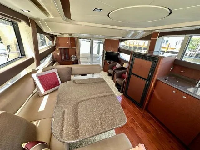 Slide: The Image of Luxurious interior of a 2013 Meridian 441 Sedan yacht with modern furnishings. - 18