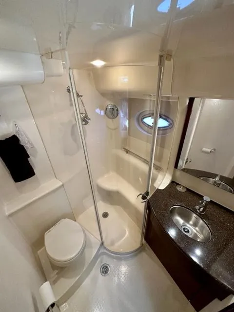 Slide: The Image of 2013 Meridian 441 Sedan yacht bathroom with shower, toilet, and sink. - 20