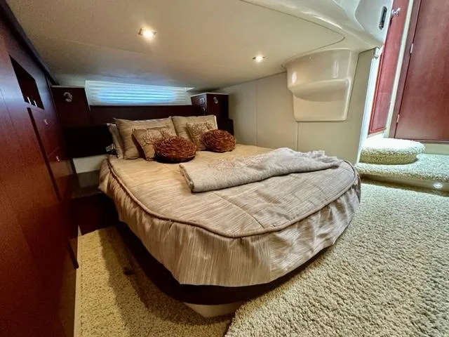 Slide: The Image of Luxurious bedroom in 2013 Meridian 441 Sedan yacht with cozy bedding and elegant decor. - 21