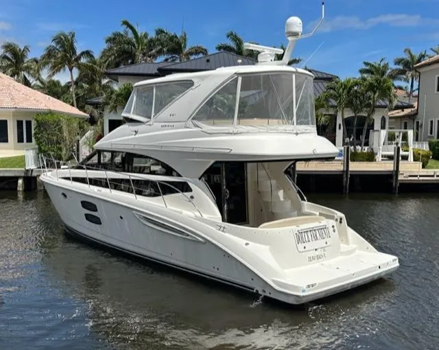Slide: The Image of 2013 Meridian 441 Sedan yacht docked in a sunny marina. - 3