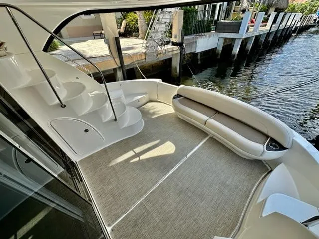 Slide: The Image of 2013 Meridian 441 Sedan yacht with spacious deck and waterfront view. - 7