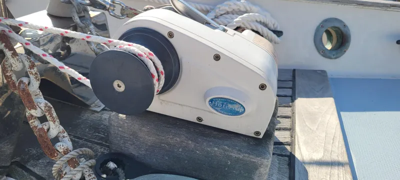 Slide: The Image of 1976 Westsail Ketch winch with ropes on deck, sunlight casting shadows. - 27