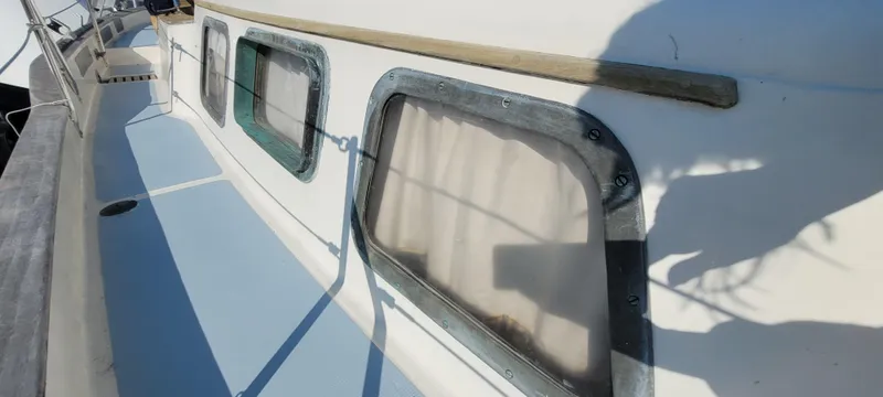 Slide: The Image of 1976 Westsail Ketch deck with windows and shadows. - 31