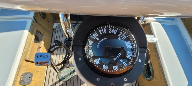 Slide: The Image of Compass on 1976 Westsail Ketch boat deck, showing navigation details. - 34