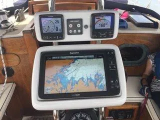 Slide: The Image of 1976 Westsail Ketch cockpit with navigation instruments and Raymarine chartplotter display. - 7