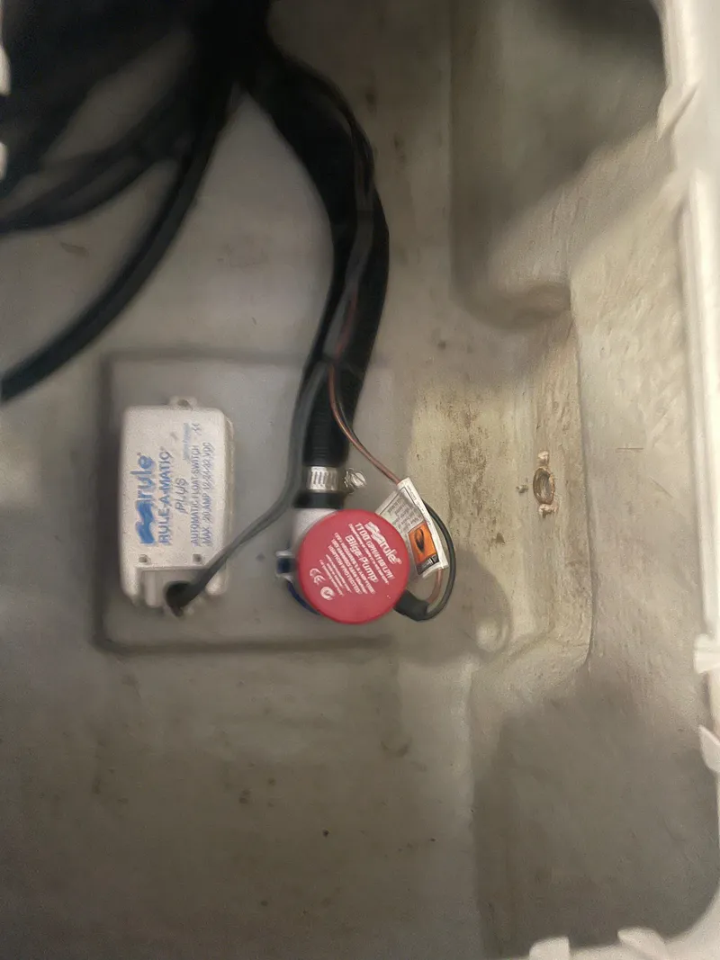 Slide: The Image of 2013 KenCraft Bay Rider 1860 boat interior with wiring and components. - 12