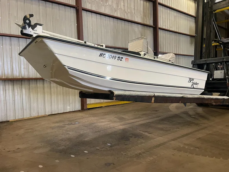 Slide: The Image of 2013 KenCraft Bay Rider 1860 boat in warehouse, side view. - 3