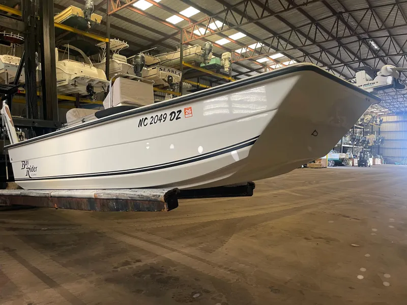 Slide: The Image of 2013 KenCraft Bay Rider 1860 boat in warehouse, side view. - 5