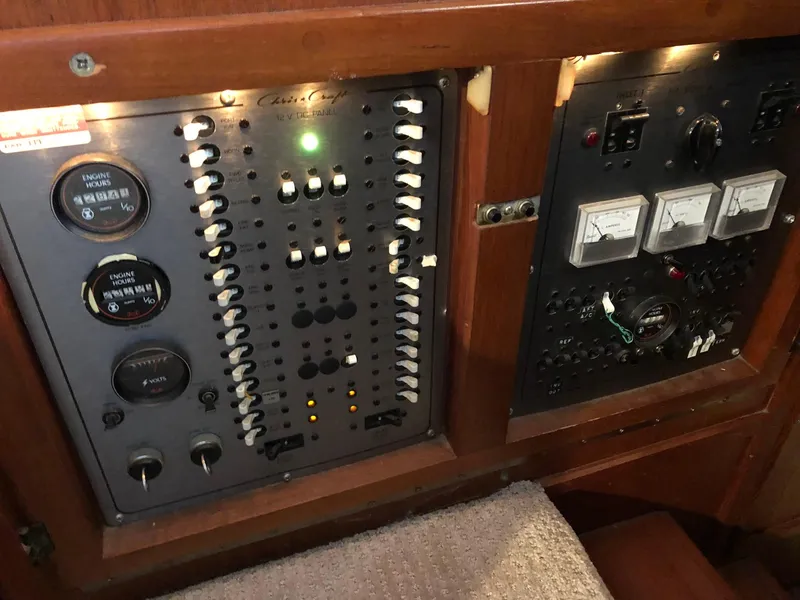 Slide: The Image of 1986 Chris-Craft Catalina control panel with gauges and switches. - 20