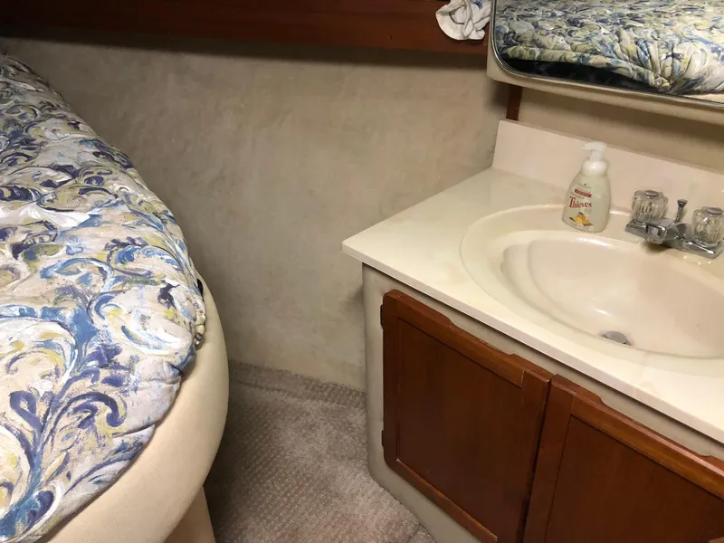Slide: The Image of 1986 Chris-Craft Catalina boat interior with sink and bed. - 27