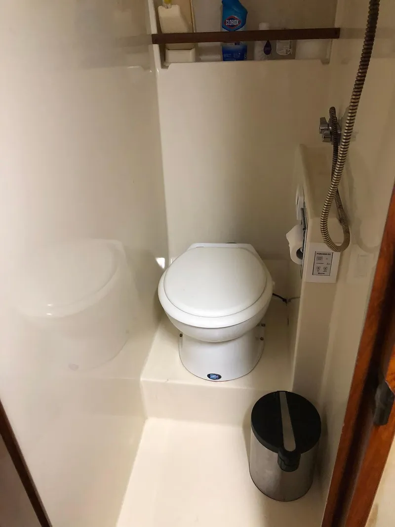 Slide: The Image of Compact bathroom in 1986 Chris-Craft Catalina boat with toilet and shower. - 33