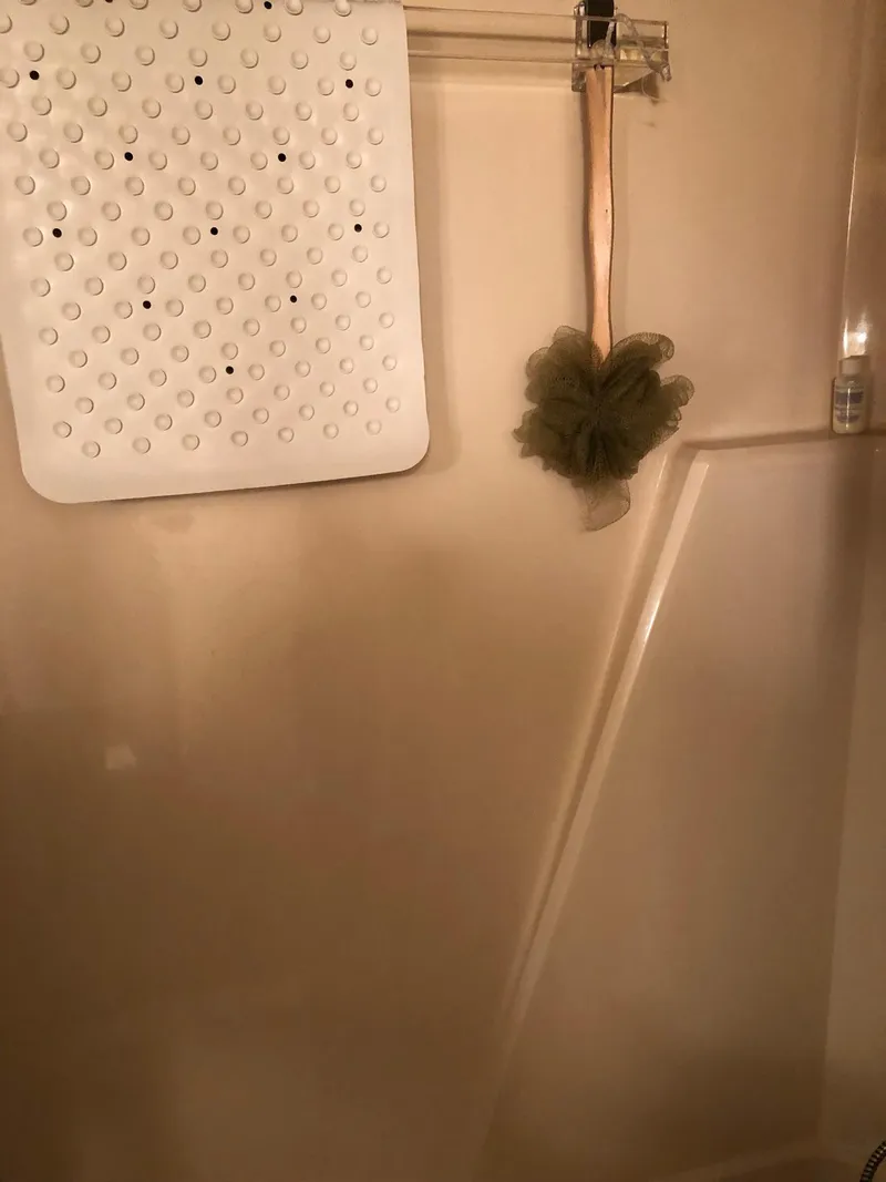 Slide: The Image of 1986 Chris-Craft Catalina boat shower with bath mat and loofah. - 44