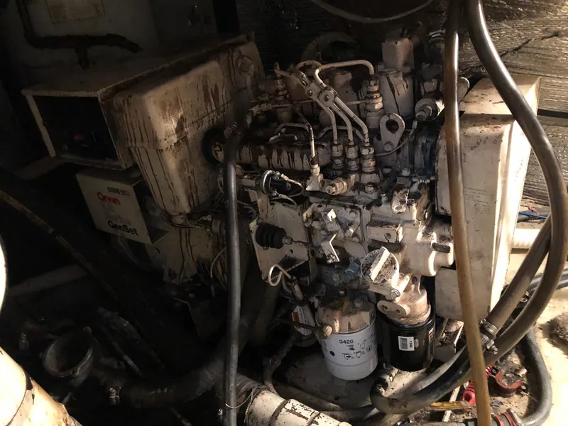 Slide: The Image of 1986 Chris-Craft Catalina engine compartment with Cummins Onan generator. - 45