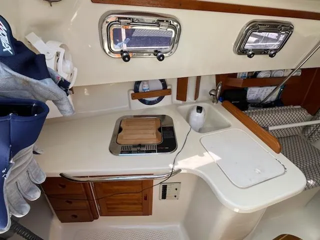 Slide: The Image of Interior of 2010 Seaward 26RK sailboat with compact kitchen and storage. - 19