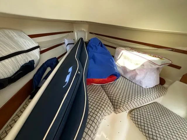 Slide: The Image of Interior cabin of a 2010 Seaward 26RK sailboat with storage bags and cushions. - 22