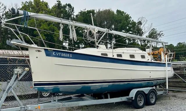 Slide: The Image of 2010 Seaward 26RK sailboat on trailer, parked outdoors. - 26