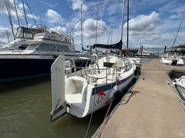 Slide: The Image of 2010 Seaward 26RK sailboat docked at a marina on a sunny day. - 3