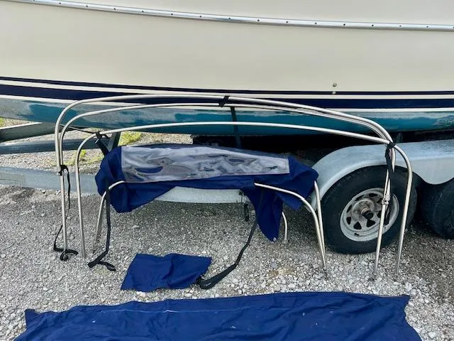 Slide: The Image of Seaward 26RK 2010 boat on trailer with metal frame and blue fabric cover. - 34