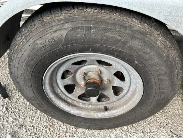 Slide: The Image of Rusty wheel of a 2010 Seaward 26RK on gravel surface. - 36