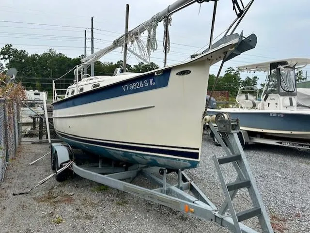 Slide: The Image of 2010 Seaward 26RK sailboat on trailer, parked in a gravel lot. - 38