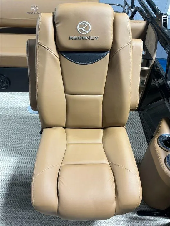 Slide: The Image of 2024 Regency 230 LE3 Sport boat seat in tan leather. - 10