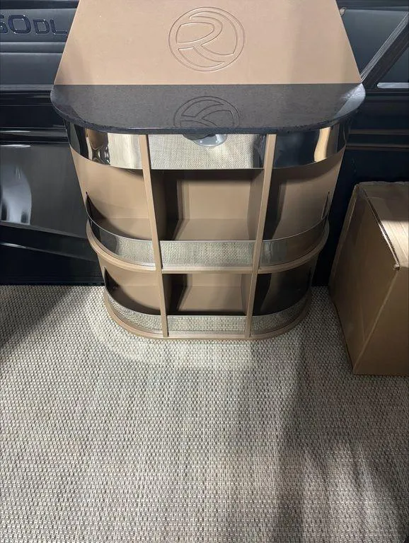 Slide: The Image of 2024 Regency 230 LE3 Sport interior detail with storage compartments. - 8