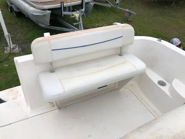 Slide: The Image of 2007 Bayliner 275 boat with white seating and slight discoloration. - 10