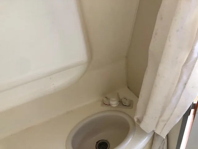 Slide: The Image of 2007 Bayliner 275 boat bathroom sink and faucet. - 28