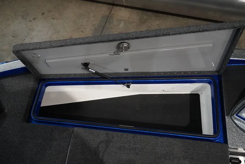 Slide: The Image of Open storage compartment on a 2020 Caymas CX 20 PRO boat. - 10