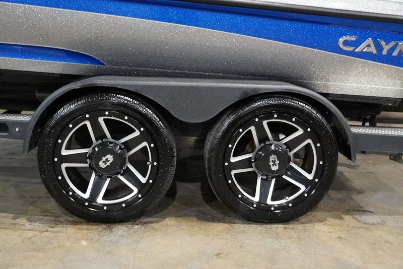 Slide: The Image of 2020 Caymas CX 20 PRO boat trailer with dual black and silver alloy wheels. - 3