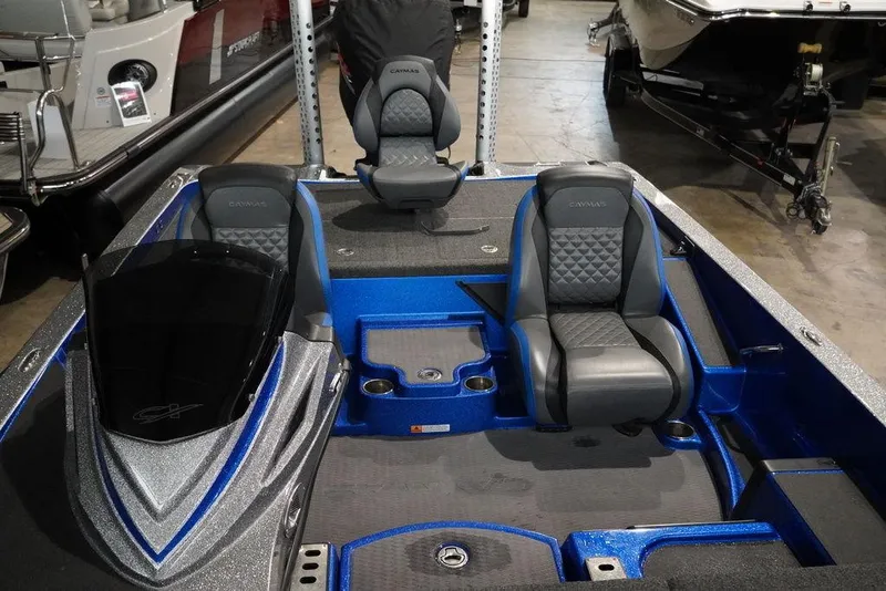 Slide: The Image of 2020 Caymas CX 20 PRO boat interior with blue and gray seating. - 5