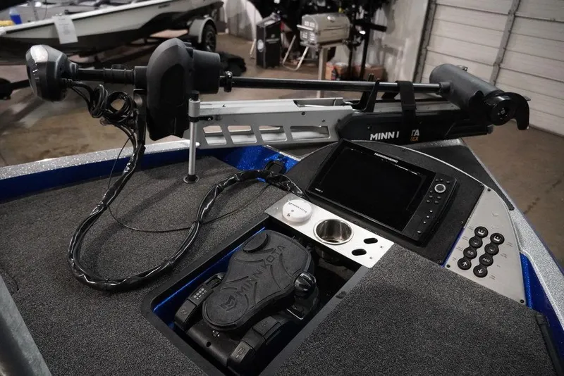 Slide: The Image of 2020 Caymas CX 20 PRO boat dashboard with Minn Kota trolling motor and control panel. - 6