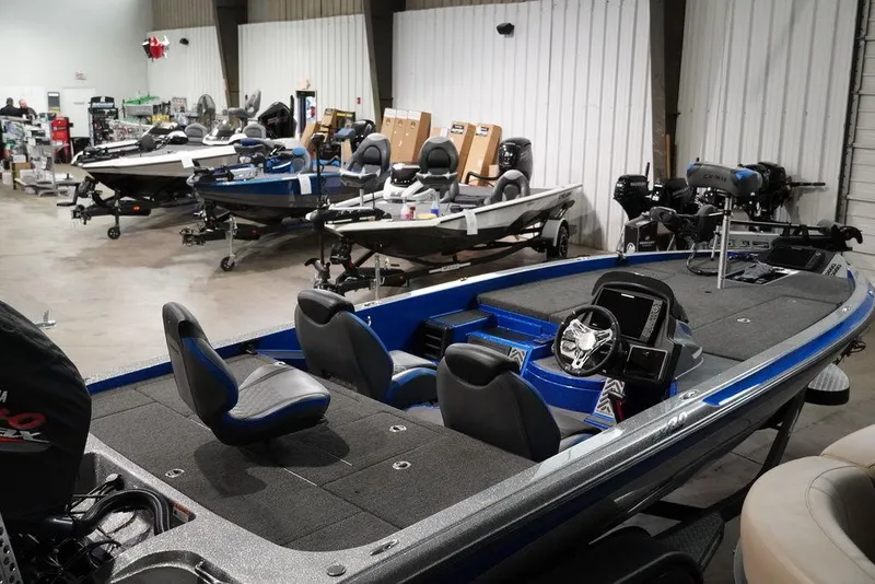 Slide: The Image of 2020 Caymas CX 20 PRO bass boat in showroom with other boats. - 8