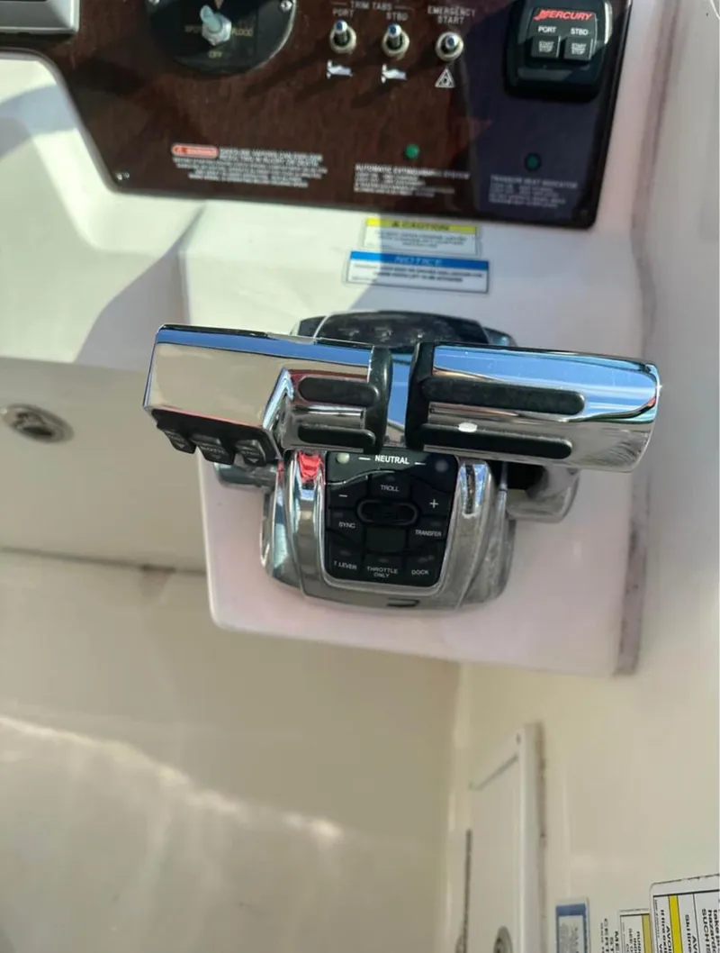 Slide: The Image of Close-up of 2013 Sea Ray Sundancer boat throttle controls and dashboard. - 2