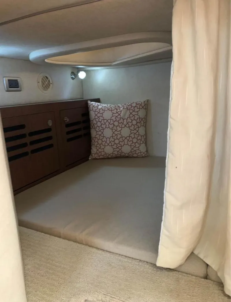 Slide: The Image of Cozy cabin interior of 2013 Sea Ray Sundancer with cushion and ambient lighting. - 9