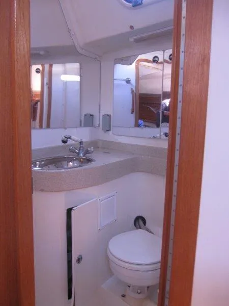 Slide: The Image of 2007 Catalina MkII boat bathroom with sink, mirror, and toilet. - 11