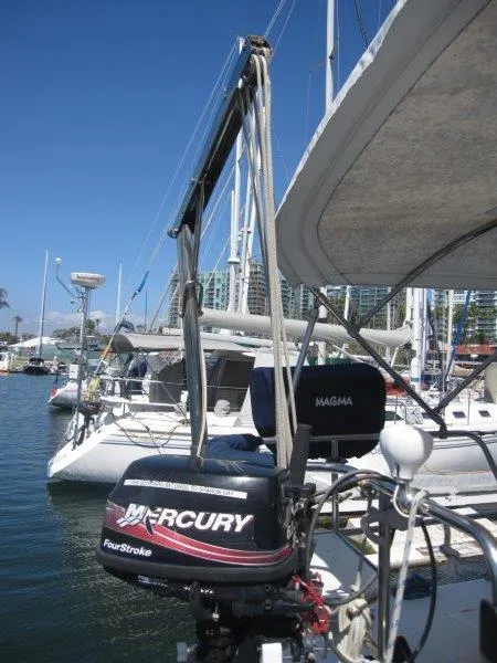 Slide: The Image of 2007 Catalina MkII sailboat with Mercury outboard motor docked in marina. - 26