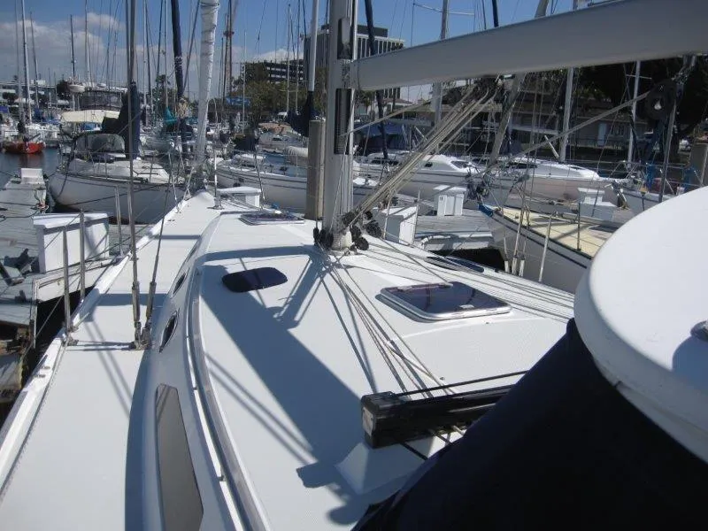 Slide: The Image of 2007 Catalina MkII sailboat docked at a marina, view of the deck and rigging. - 29
