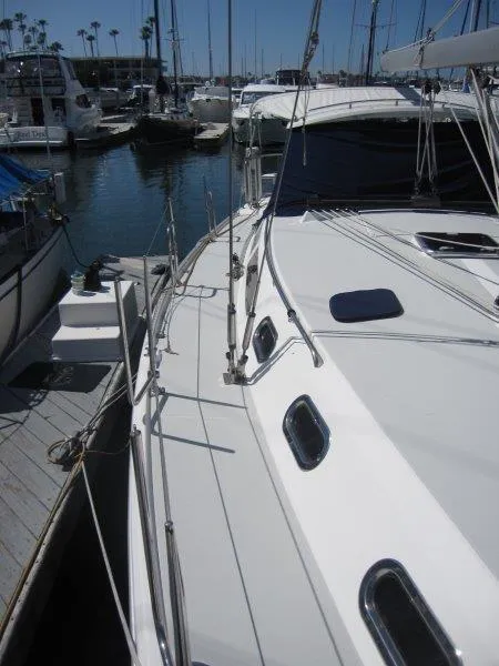 Slide: The Image of 2007 Catalina MkII sailboat docked at a marina with other boats. - 33