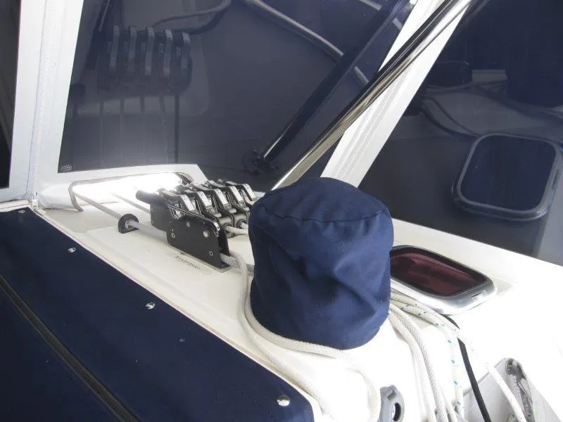 Slide: The Image of Close-up of 2007 Catalina MkII sailboat deck with covered winch and control lines. - 39