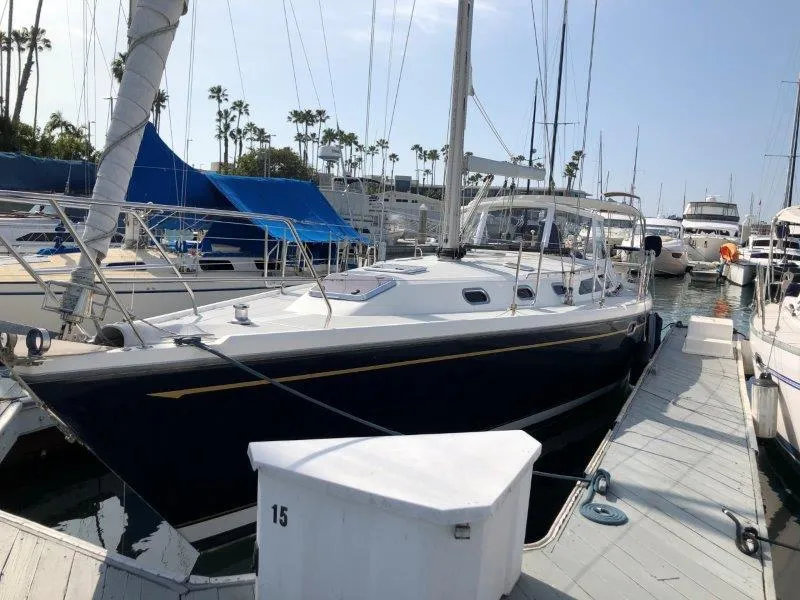 Slide: The Image of 2007 Catalina MkII sailboat docked at marina with other boats. - 44