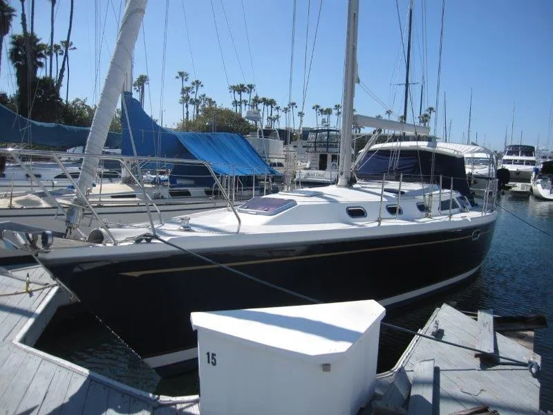Slide: The Image of 2007 Catalina MkII sailboat docked at a marina. - 47