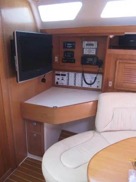 Slide: The Image of 2007 Catalina MkII yacht interior with navigation equipment and seating area. - 7