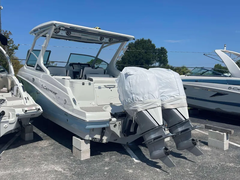 Slide: The Image of 2024 Crownline 260 DC boat with dual outboard motors on display. - 4