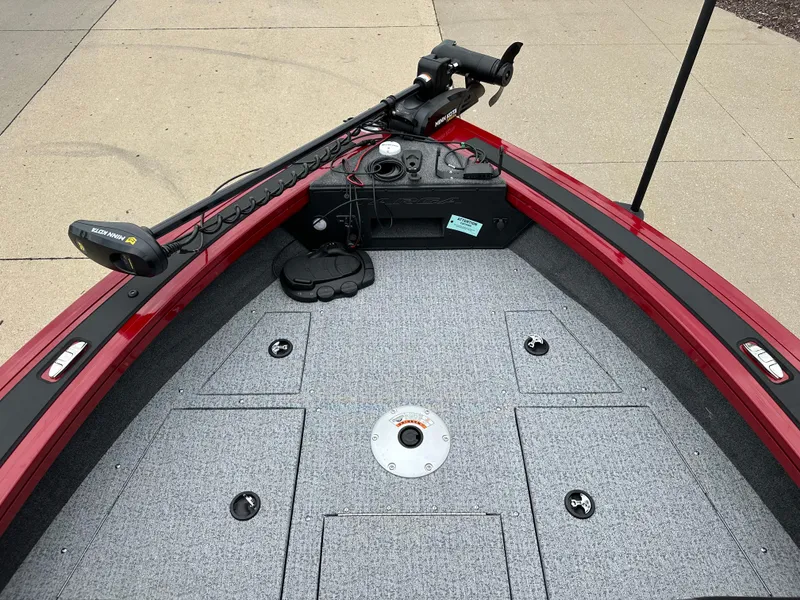 Slide: The Image of 2024 Tracker Targa V-19 WT boat deck with trolling motor and storage compartments. - 3